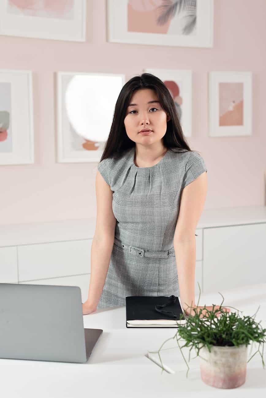 a pretty woman in a grey dress